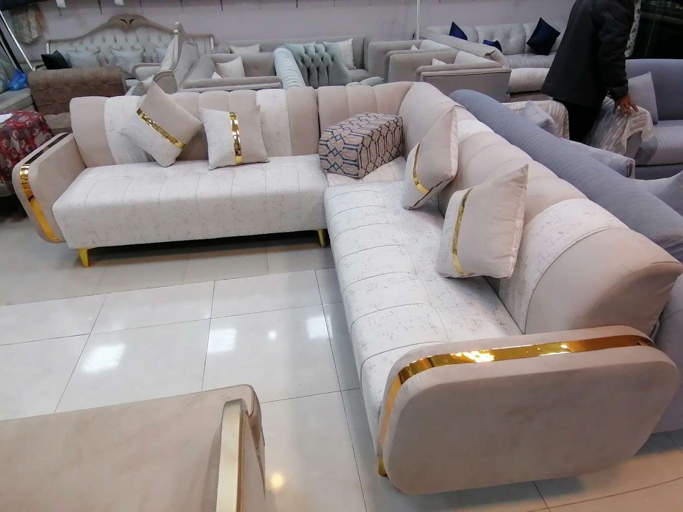 Luxury modern L-shaped sofa with golden touches – the best baytul stayr interiors Riyadh